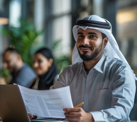 man-sits-table-with-laptop-man-white-shirt-is-working-laptop (1)